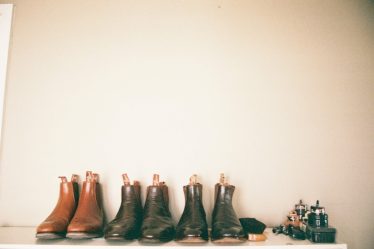 three pairs of leather shoes