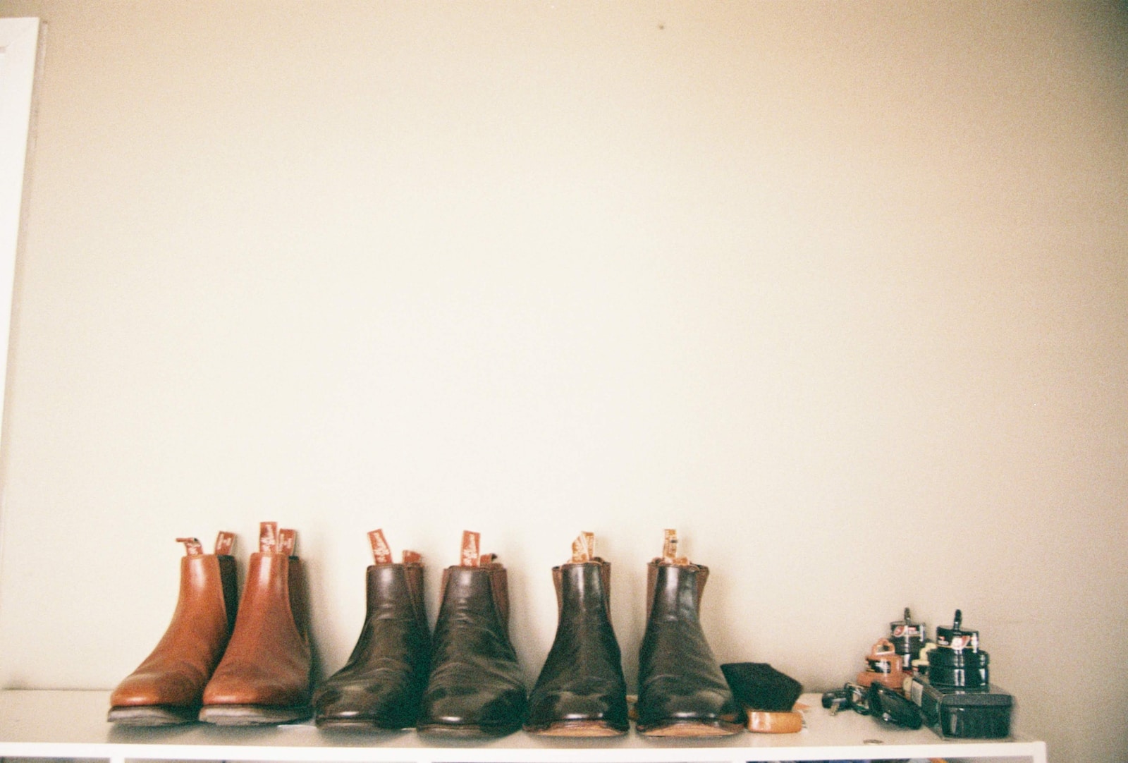 three pairs of leather shoes